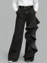 PANTALÓN VAQUERO WIDE LEG CON VOLANTE ASIMÉTRICO